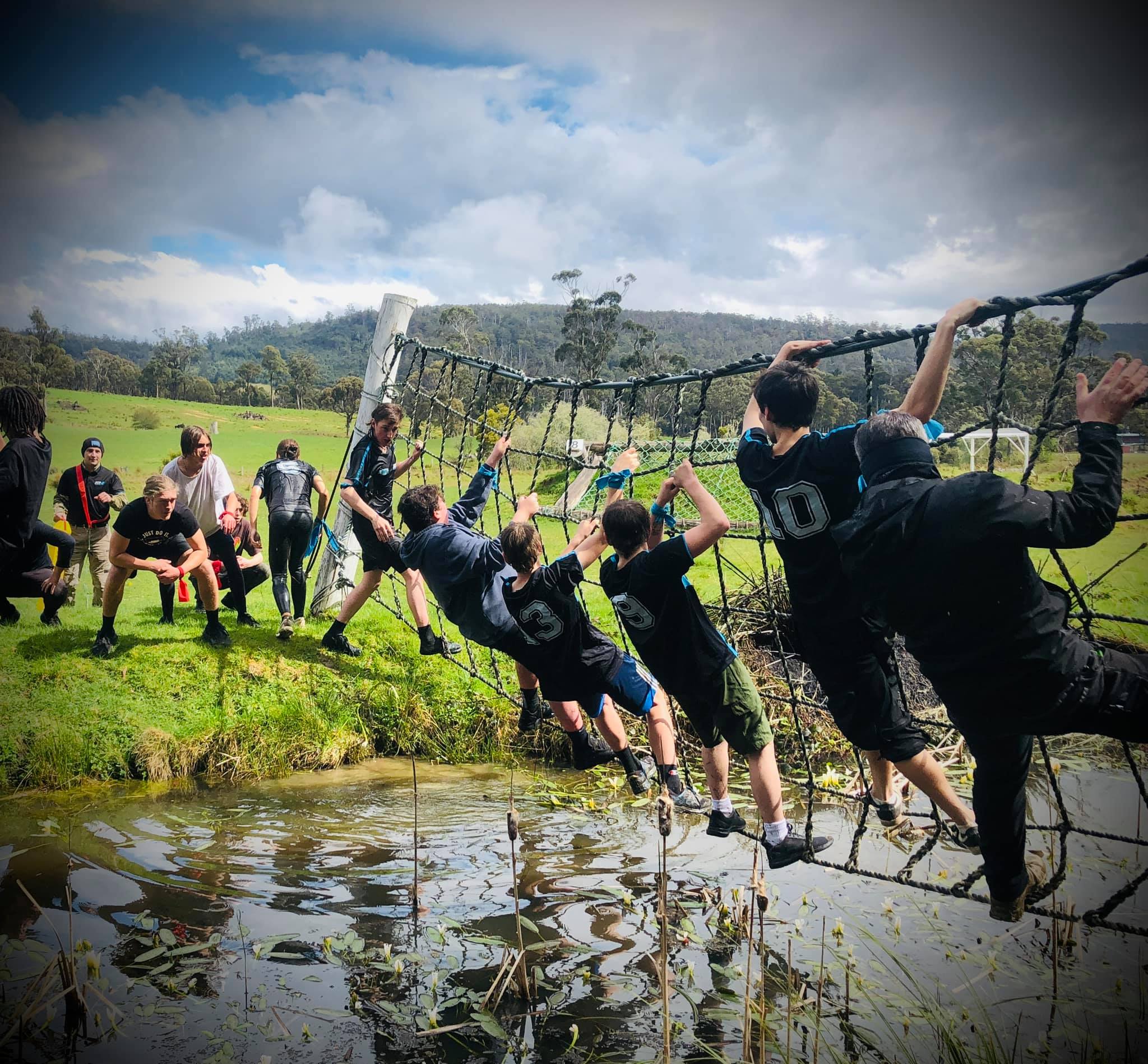 Young people taking part in an outdoor climbing activity