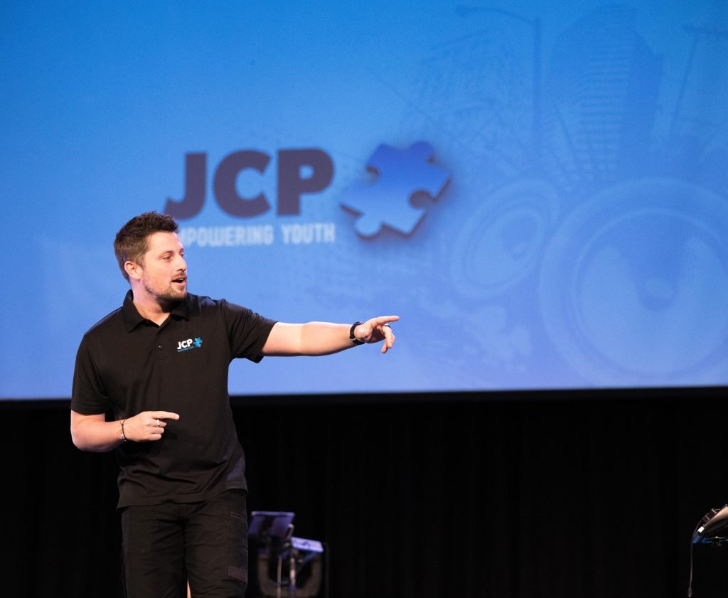A JCP Youth presenter speaking at a program