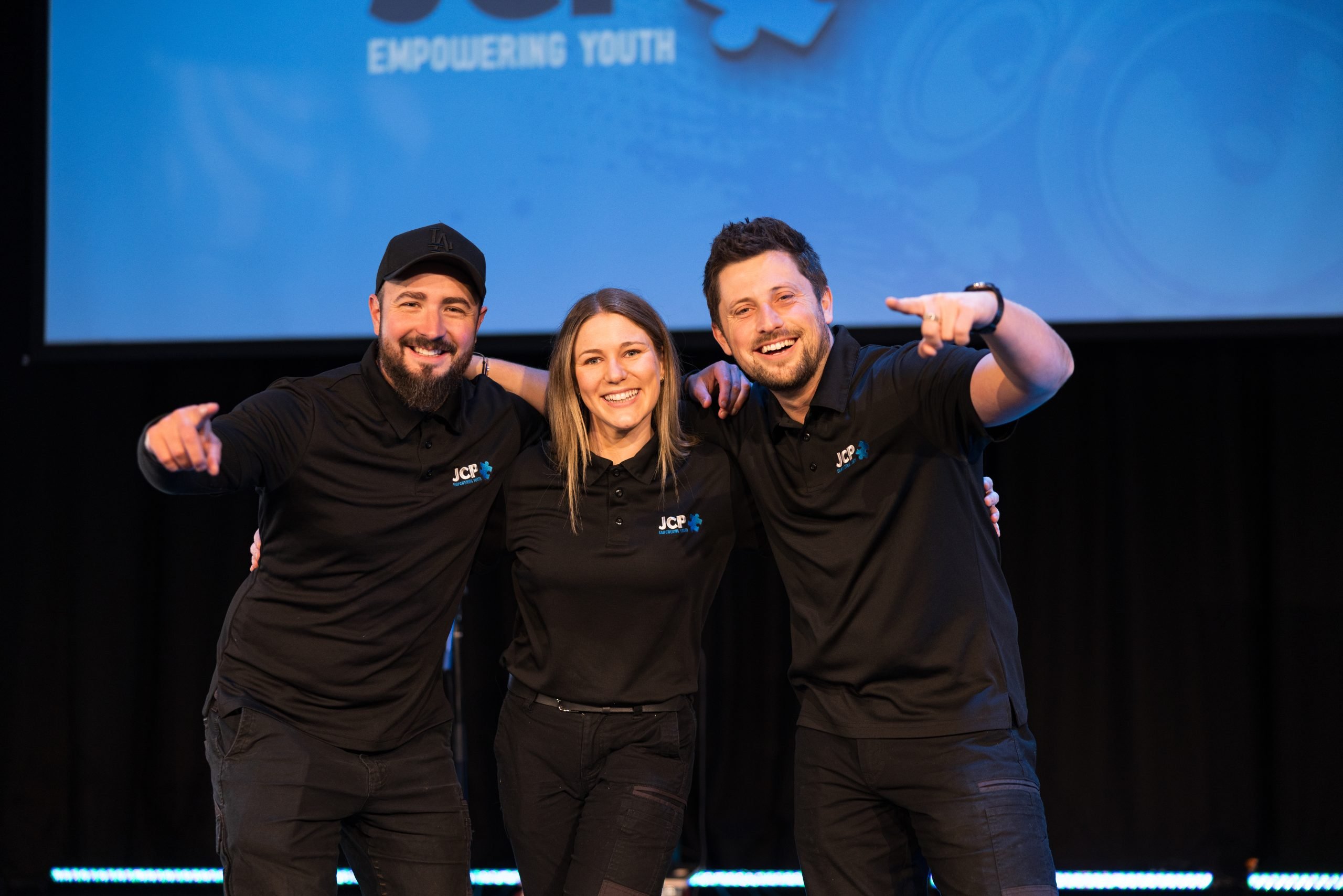 Three JCP Youth staff smiling together
