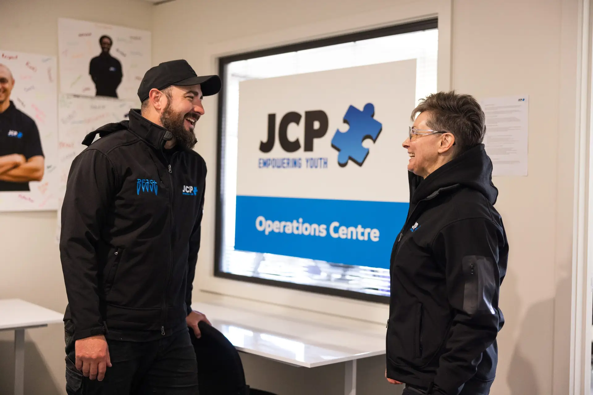JCP Youth team members sharing a conversation at the Operations Centre