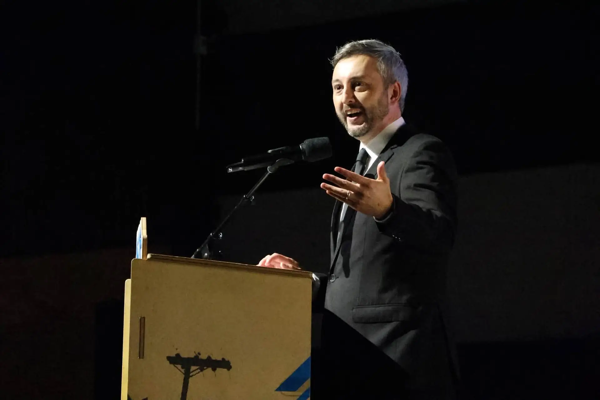 A speaker at a lectern during the 2026 JCP Youth Gala.