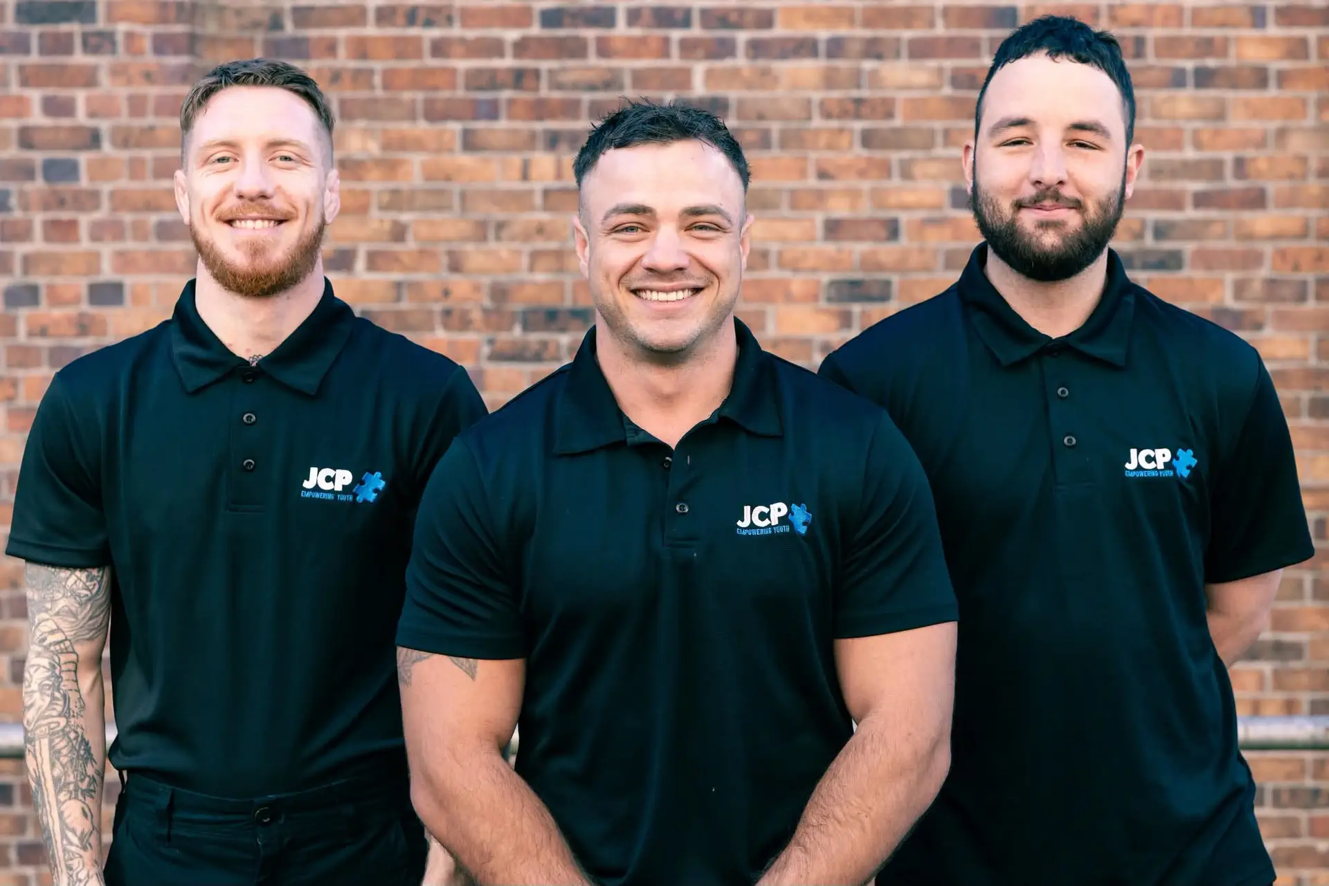 Three new JCP Youth Northern District team members wearing JCP polo shirts.